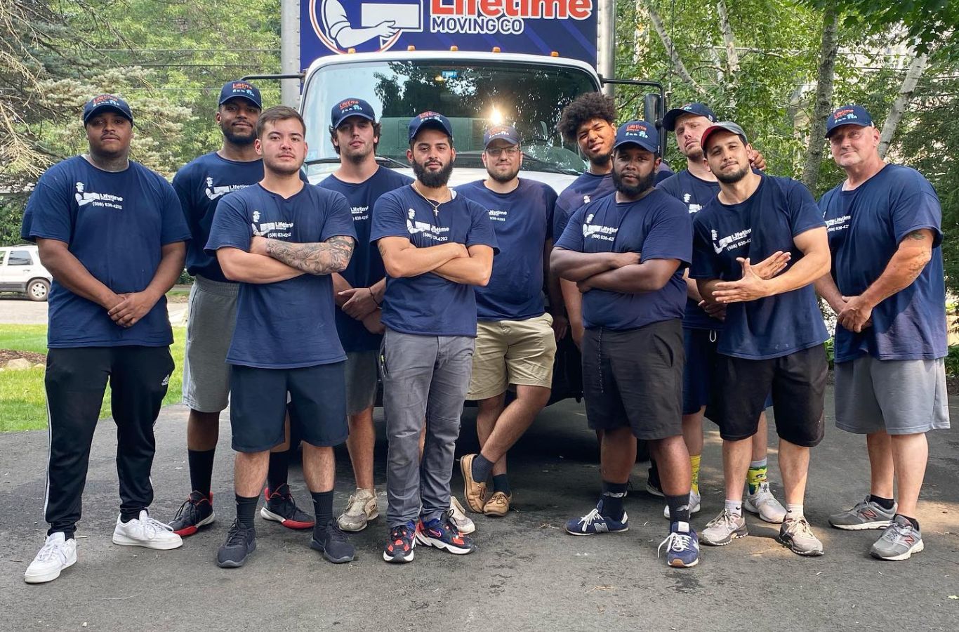 A Lifetime Moving Co mover organizes furniture in Walpole, MA; Residential Movers showing the value of trusted local moving services.