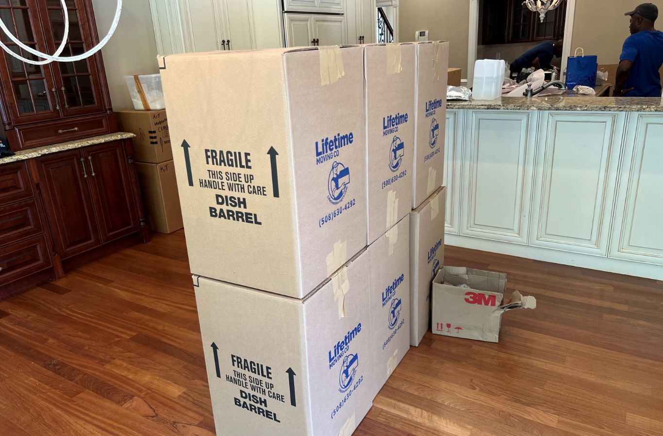 A Lifetime Moving Co expert secures furniture in Needham, MA; Residential Movers use straps for safe, damage-free moves. Residential Movers near me.