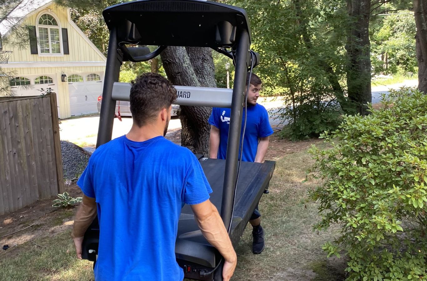 Lifetime Moving Co mover wrapping furniture in Marlborough, MA, highlighting benefits of safe and reliable moving services