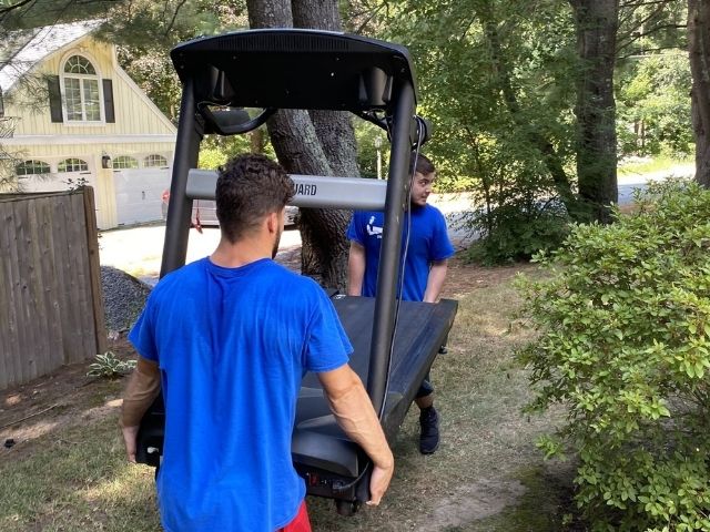 Lifetime Moving Co team securing furniture for a Senior Movers move in Dedham, MA with structured packing and attentive handling.