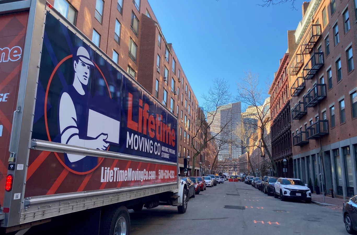 Lifetime Moving Co expert carefully relocating furniture inside a Shrewsbury, MA home. In Home Moving Near Me.